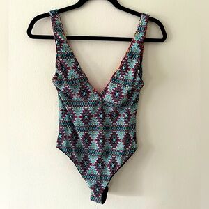 Red Carter reversible one piece swim suit, size small, Excellent condition.